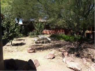Shaded Garden with rocks and a picnic table